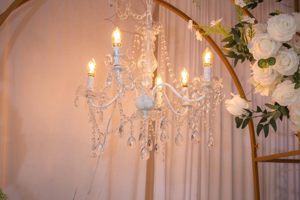 Elite Event MI — Crystal chandelier with floral accents and soft glow